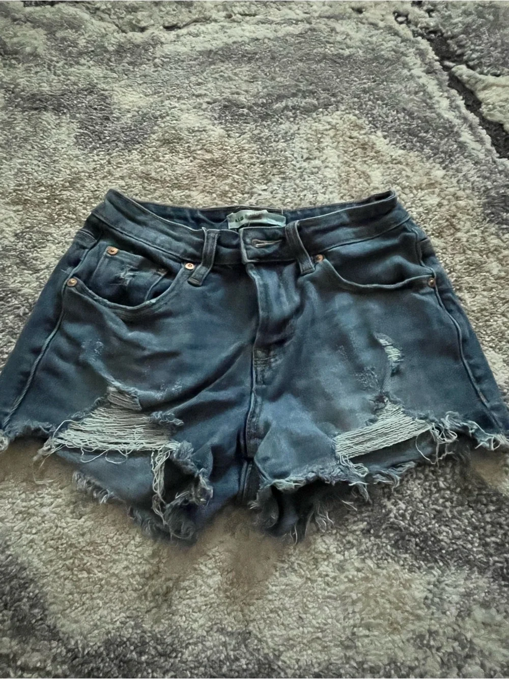 blue denim distressed shorts